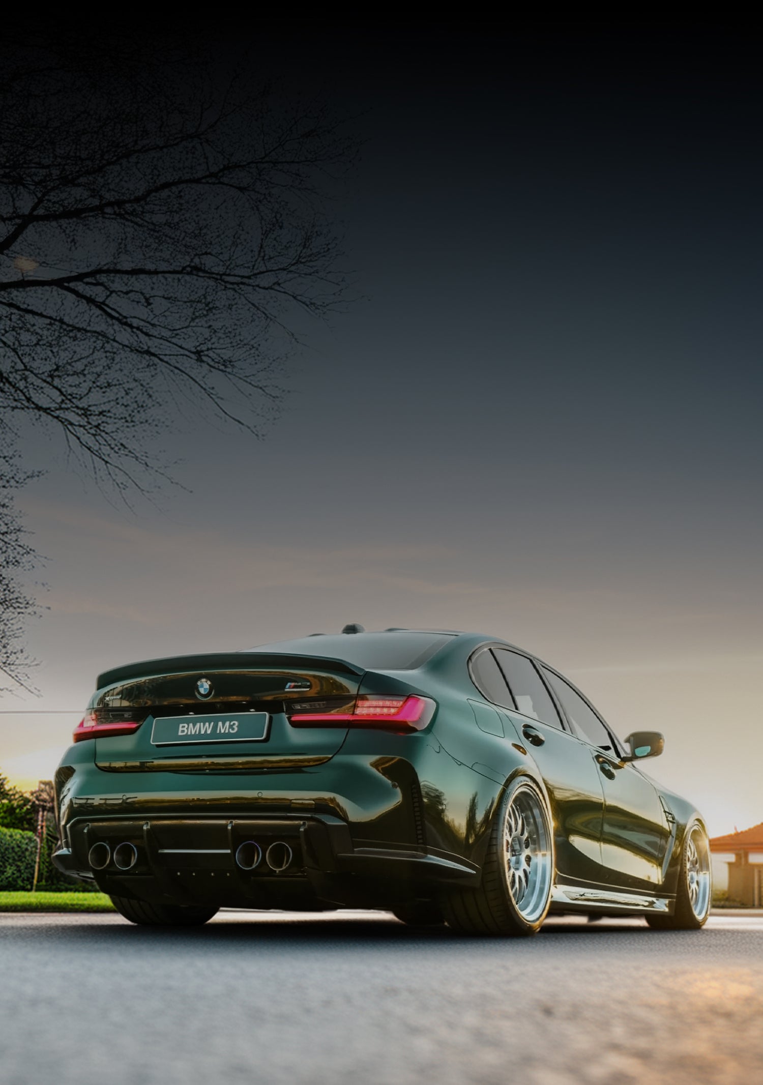 Green BMW car parked on a road with a sunset in the background